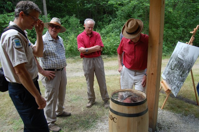 Tobi explains the use of sugar barrels to transport minerals, such as the mica shown, from the Silver Queen.